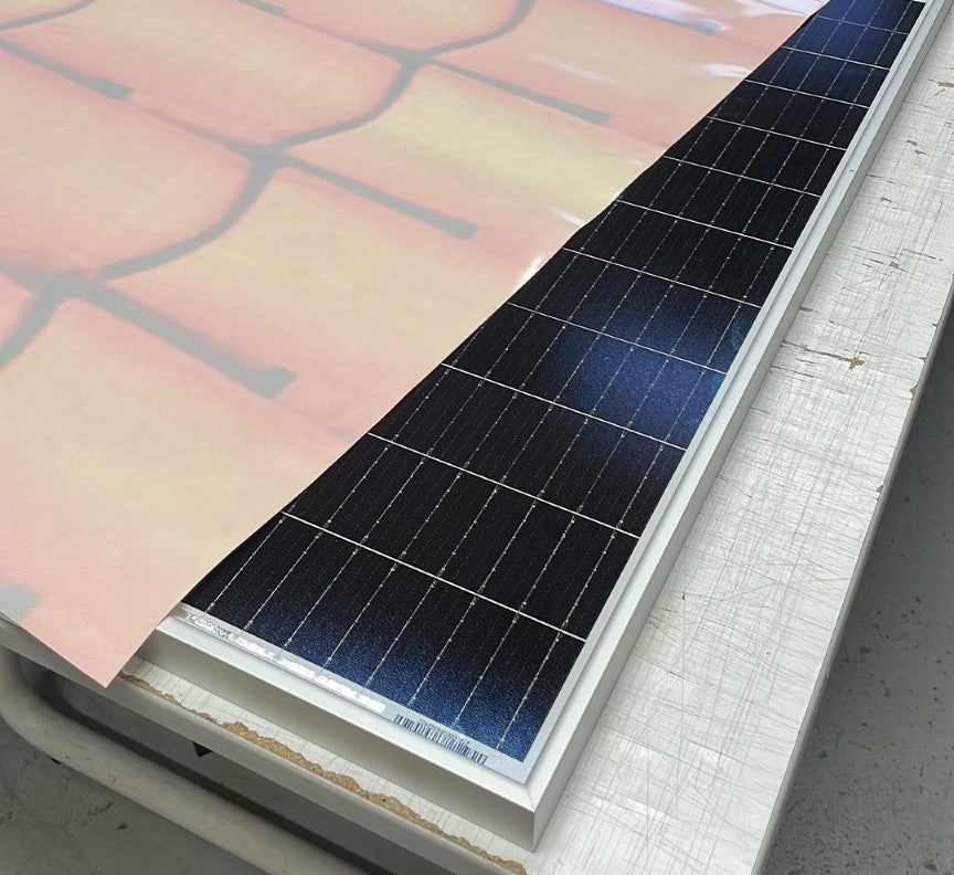 Customisable sticker to turn solar panels into advertising billboards